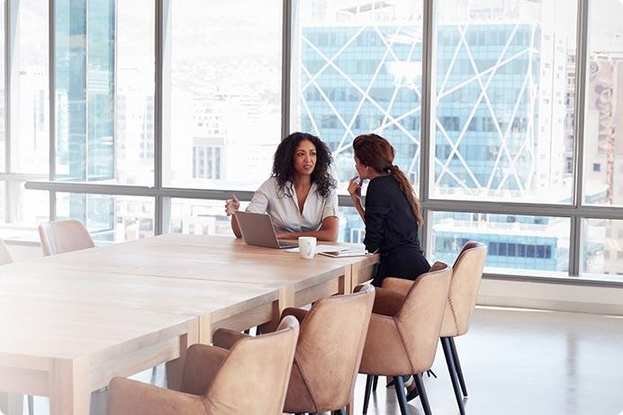 a few women sitting at a table