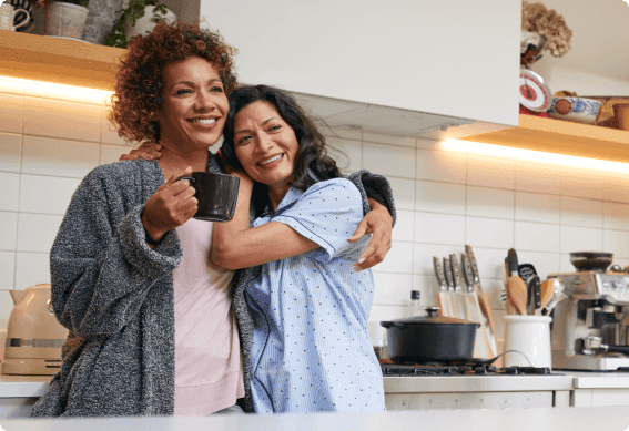 Claudia Coulter et al. taking a selfie in a kitchen