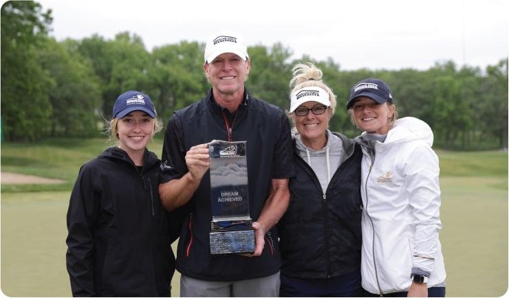 Steve Stricker et al. posing for a photo