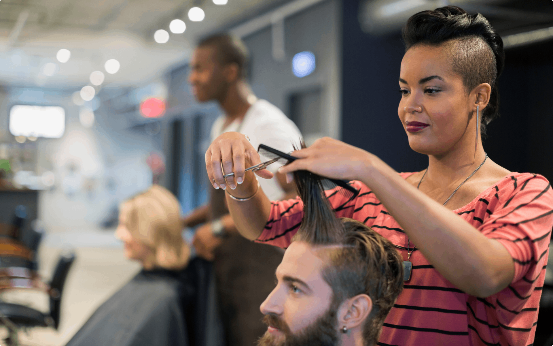A stylist cutting a client's hair.
