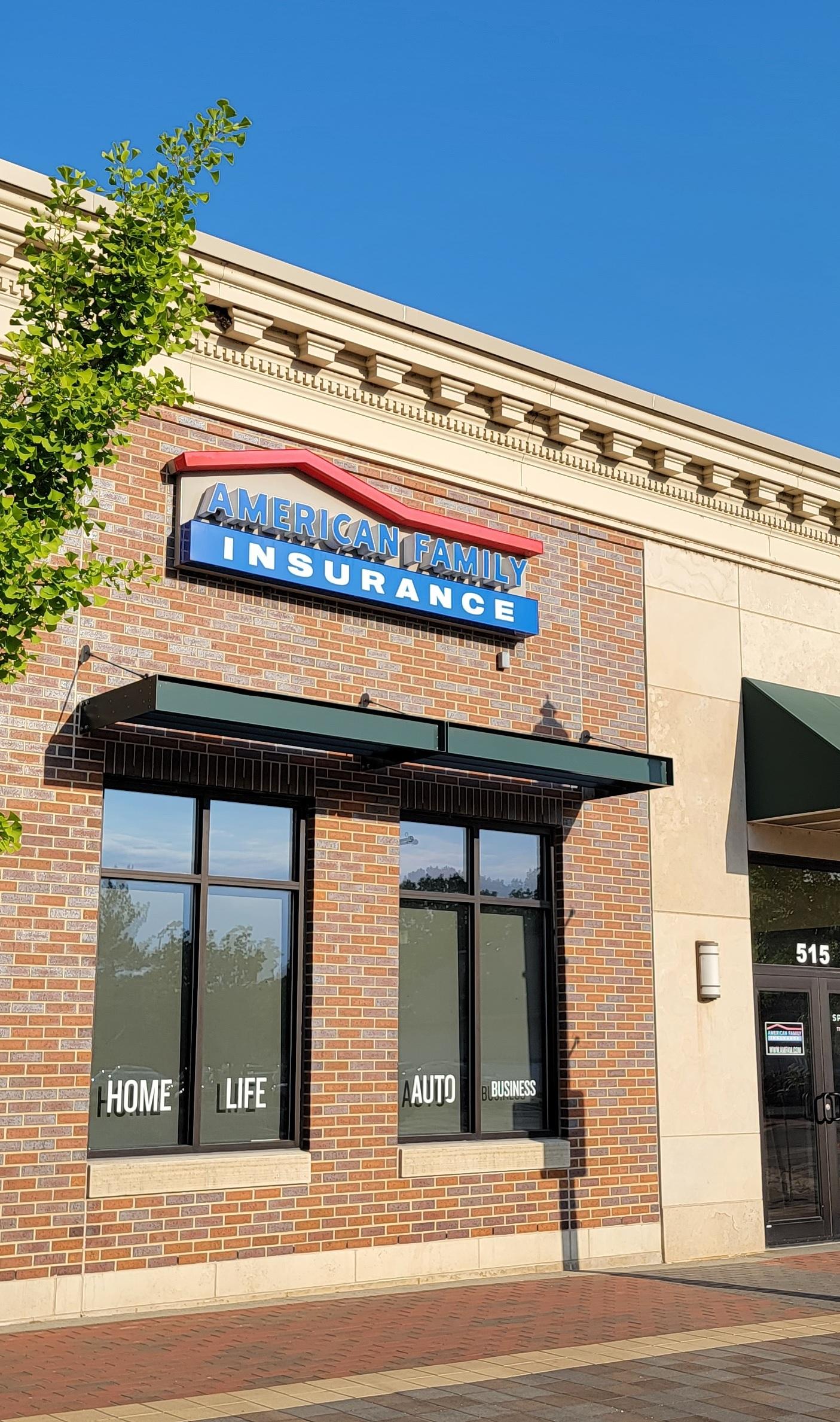 a brick building with a blue sign