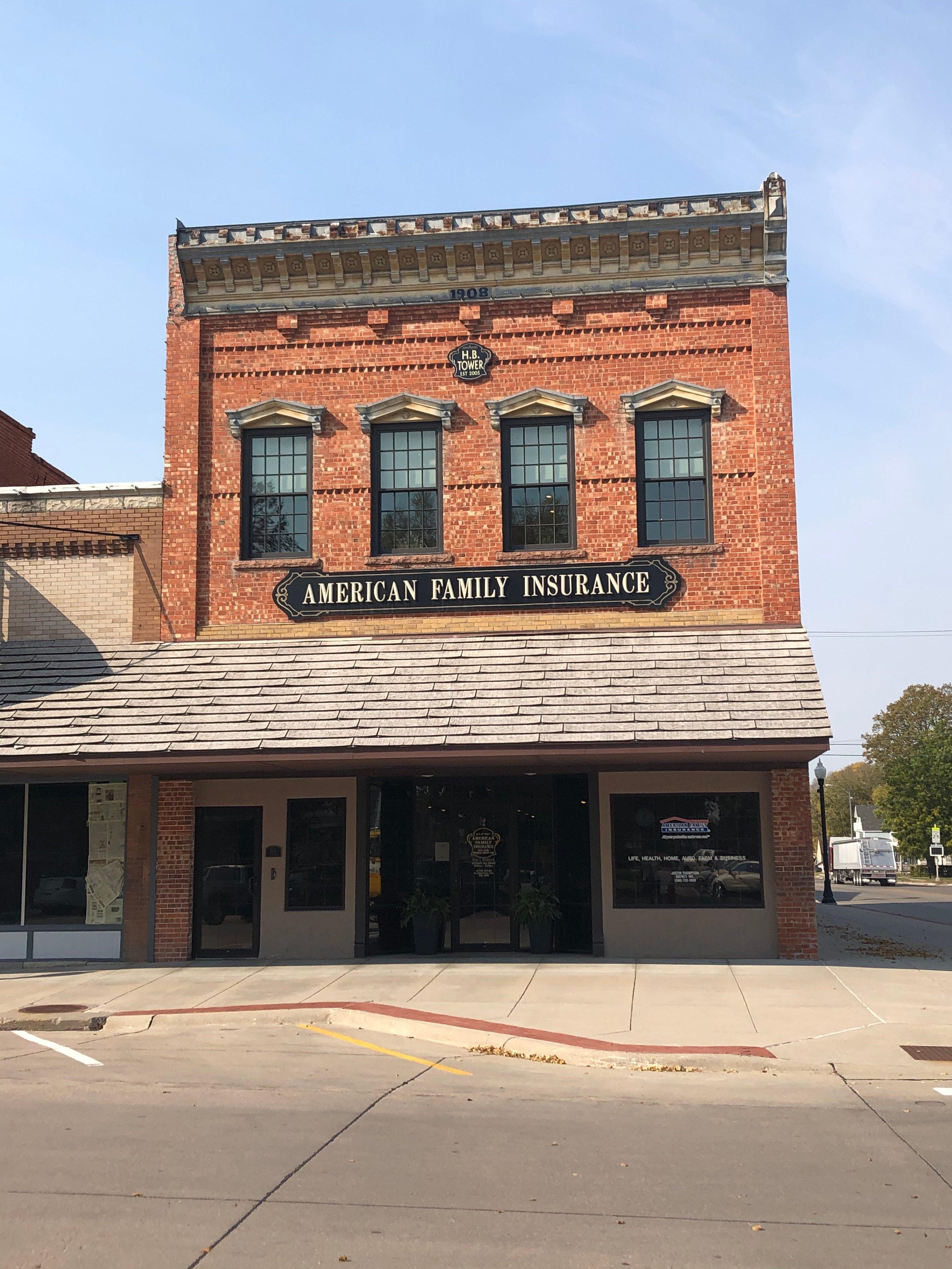 a brick building with a sign on it