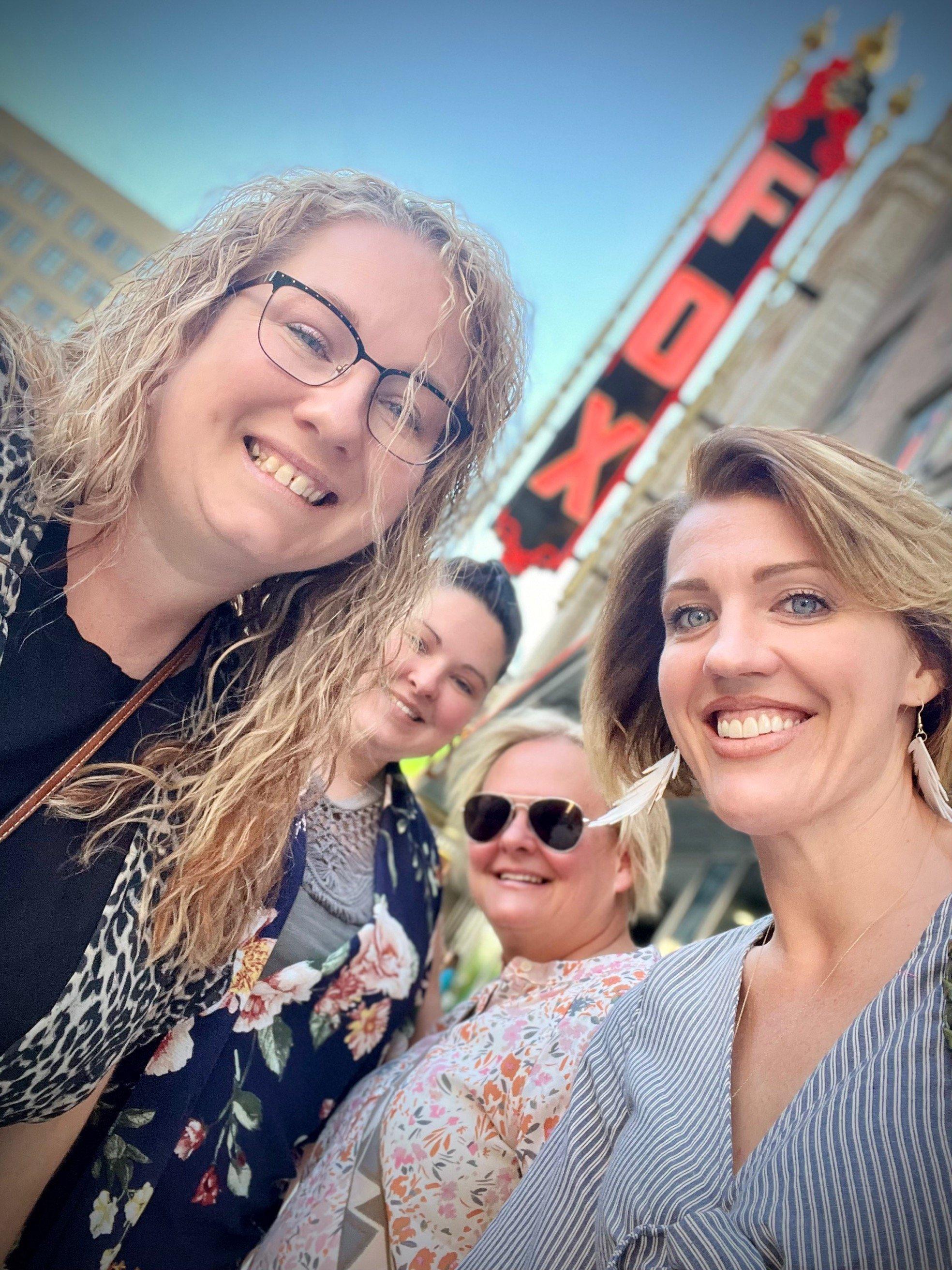 a group of women smiling