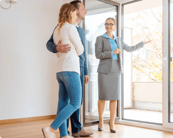 Image of a property manager showing prospective tenants a rental space.