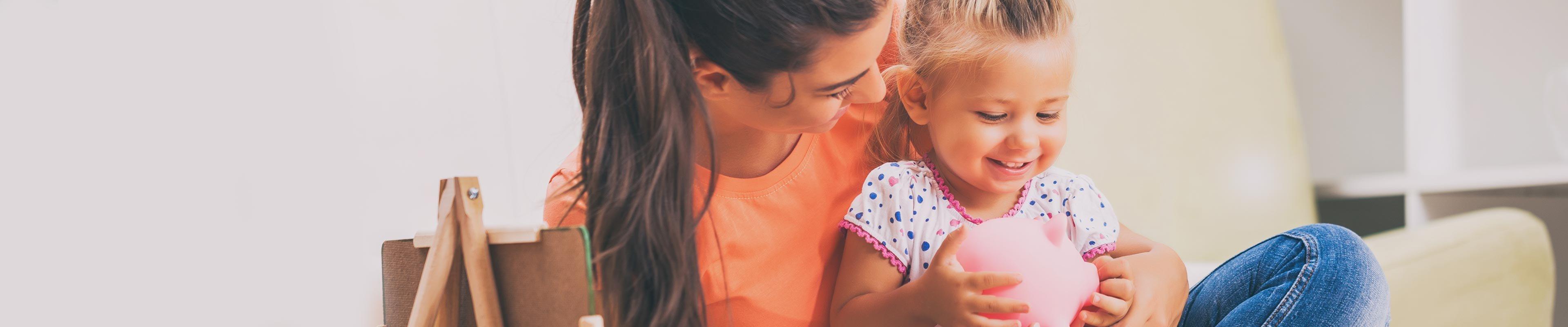 Mom and daughter with a piggy bank_how to save_D