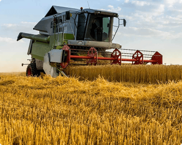 Image of a combine being operated on rented farm land.