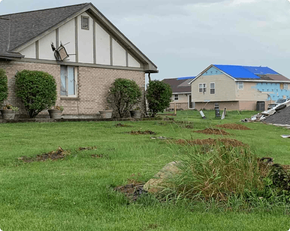 Image of a neighborhood damaged by high winds.