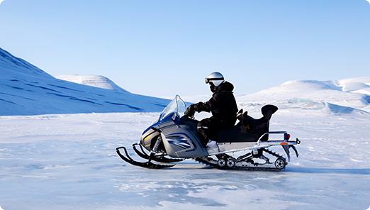 a person riding a snowmobile